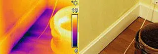 Infrared image showing air leakage around a building envelope